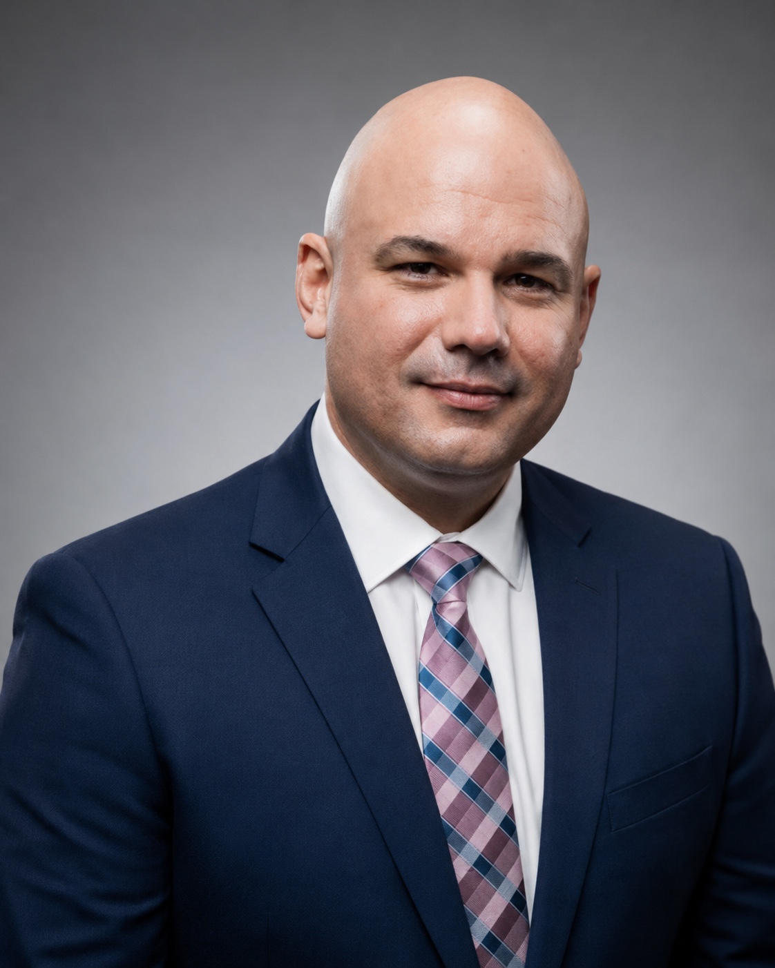 Herbert Peña in a navy suit